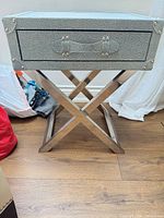 Full view of side table showing faux shagreen drawer box and chrome X-base