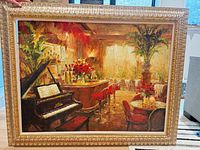 Front view of framed oil painting showing full café scene