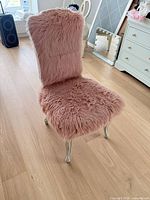 Front left view of pink faux fur accent chair