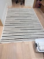 Full view of Viana striped area rug on floor