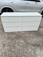 Front view of white 6-drawer dresser
