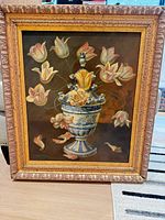 Front view of framed still life painting