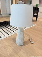 Full view of lamp showing marble base and white drum shade