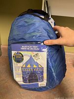 Front of packed tent showing retail label with tent image and pricing sticker