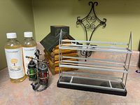Group shot of all items including spice rack, lantern shakers on stand, wooden tissue cover, two EverydayHappy bottles, wrought iron candle holder
