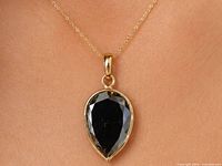 Pendant on neck showing overall design