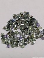 Loose faceted gemstones spread out to show colours