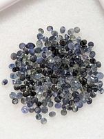 Pile of loose blue sapphire stones close-up
