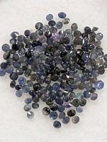 Pile of many small round faceted sapphires