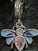 Full view of bee pendant showing stones and enamel