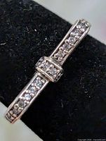 Front view of bow ring showing CZ stones