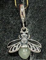 Front view of silver bee pendant with moonstone body