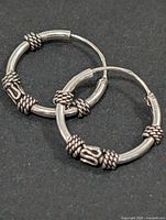 both earrings showing rope knot accents