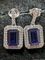 Front view of both earrings showing sapphires and CZ halo