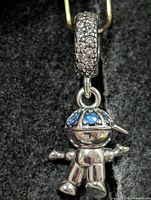 Front view of silver robot pendant with pavé bail