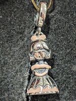 Front view of sterling silver girl charm bead with pink enamel accents