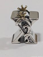 Front view of silver X bead with crowns and stone-set vine
