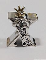 Front view of sterling silver letter charm with crown and clear stones