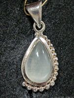 Front view of pear-shaped moonstone pendant in silver