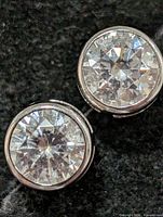 front view showing both round CZ stones in bezel settings