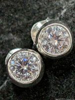 Front view of cubic zirconia studs showing bezel setting