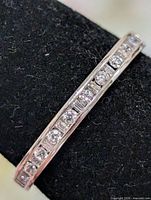 Close-up channel set CZ stones on band