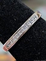 Top view of silver band showing channel-set CZ stones