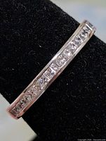 Close-up of channel-set CZ stones across the top of the silver band