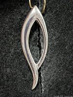 Front view of silver abstract pendant