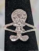 Front view of silver-tone Tweety Bird ring on stand