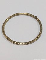 Full view of the thin silver band ring