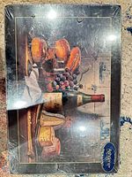 Shrink-wrapped box front showing still life design on placemat