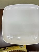 White plastic square cake tray