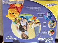 Front of boxed Disney Ready Bed showing Winnie the Pooh theme and product image
