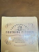 Front of sealed box showing product name and sealed wrap