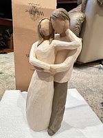 Front view of Willow Tree Together figurine with box in background