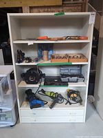 Front view showing entire cabinet with shelves and drawers