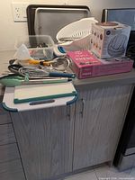 Overview of all bakeware and utensils on countertop