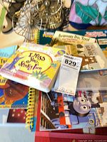 Stack of children’s books showing I Miss You Stinky Face, Little People Animals Do, Too!, Thomas & Friends titles