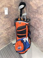 Bag and clubs full view in corner