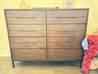 front view showing eight drawers and metal base