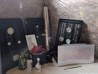 Overall view of grow light components, trays, soil bag, spray bottles, watering can, reflective materials