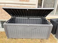 Deck box open showing interior and lid