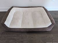 Top view of brown and cream dog bed