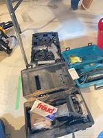 Overview of three open carrying cases with planer, blades, inspection camera