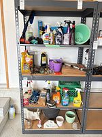 Front view of metal shelving unit with 4 shelves