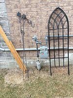 Overall lot showing trellis, two hooks, pine boards