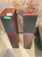 Two Totem Acoustic STTAF speakers front view with grilles