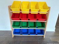 Front view showing full organizer with four rows of color bins