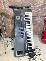 Keyboard with stand, music rest, adapter and cables